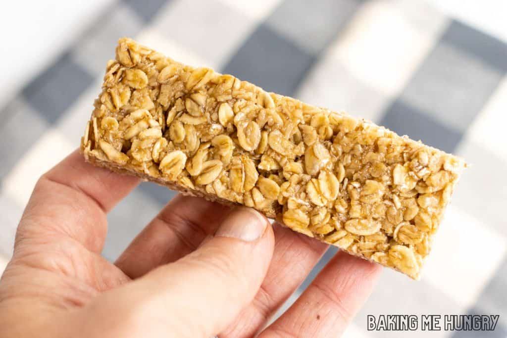 hand holding up one of the honey oat bars