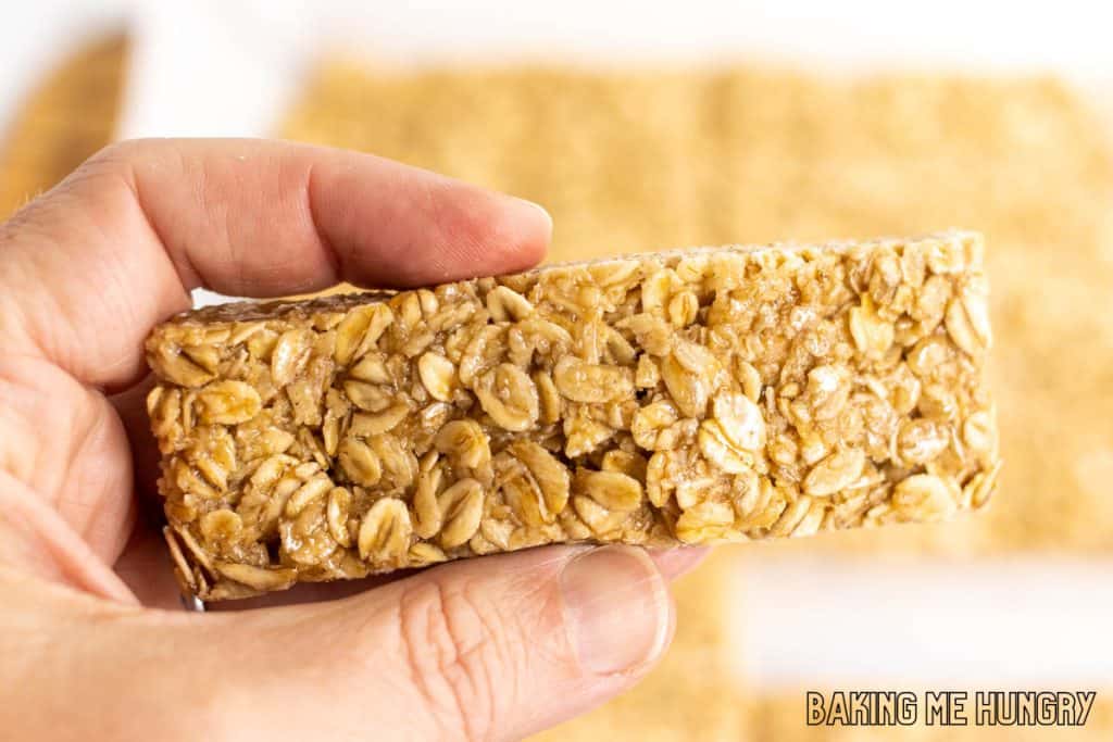 hand holding up one of the honey oat bars