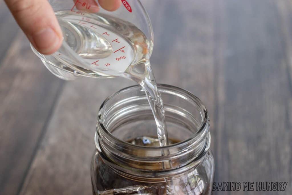 simple syrup being added to drink