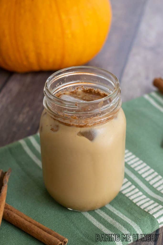 iced pumpkin spice latte in a mason jar