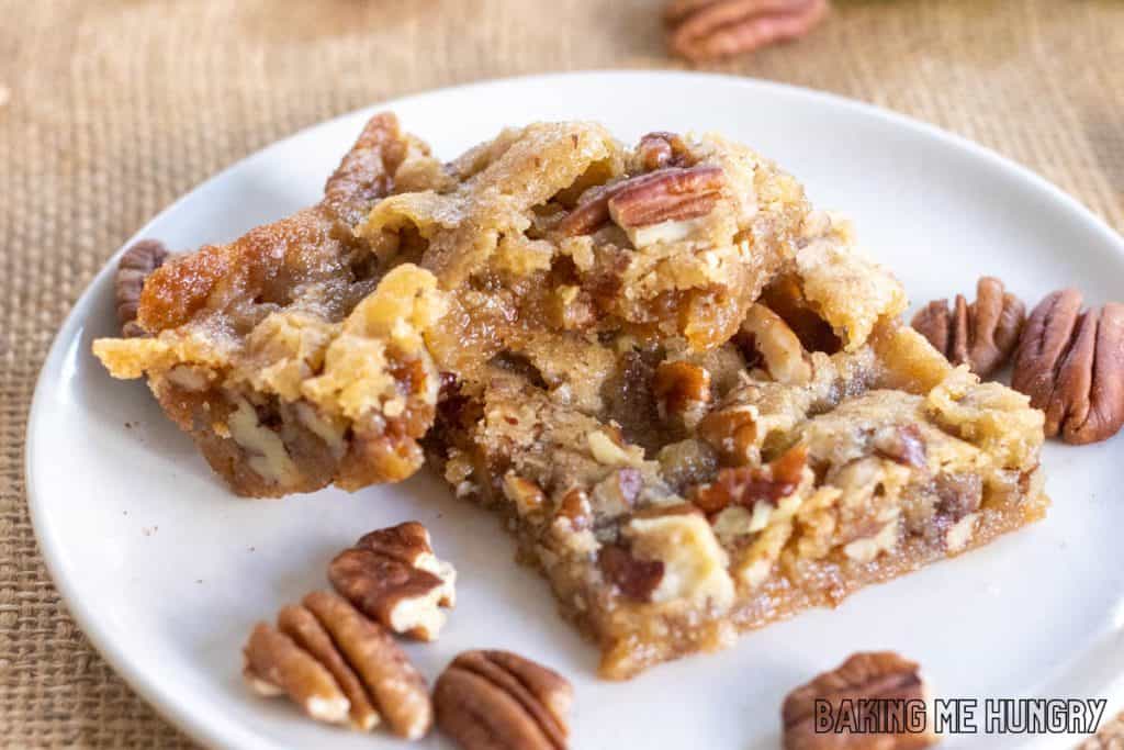 maple pecan blondies on small plate with one missing a bite