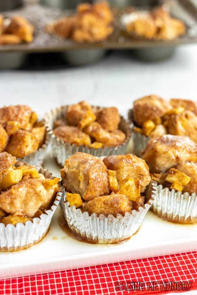 mini monkey bread close up on white platter with muffin tin behind