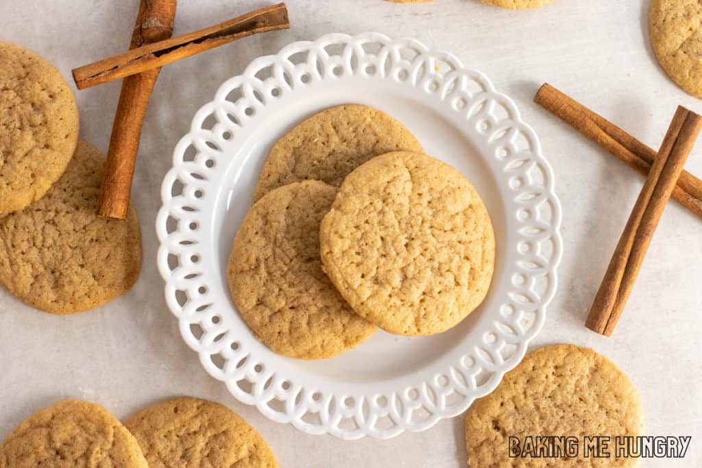 pumpkin spice sugar cookies on small white decorative plate from overhead