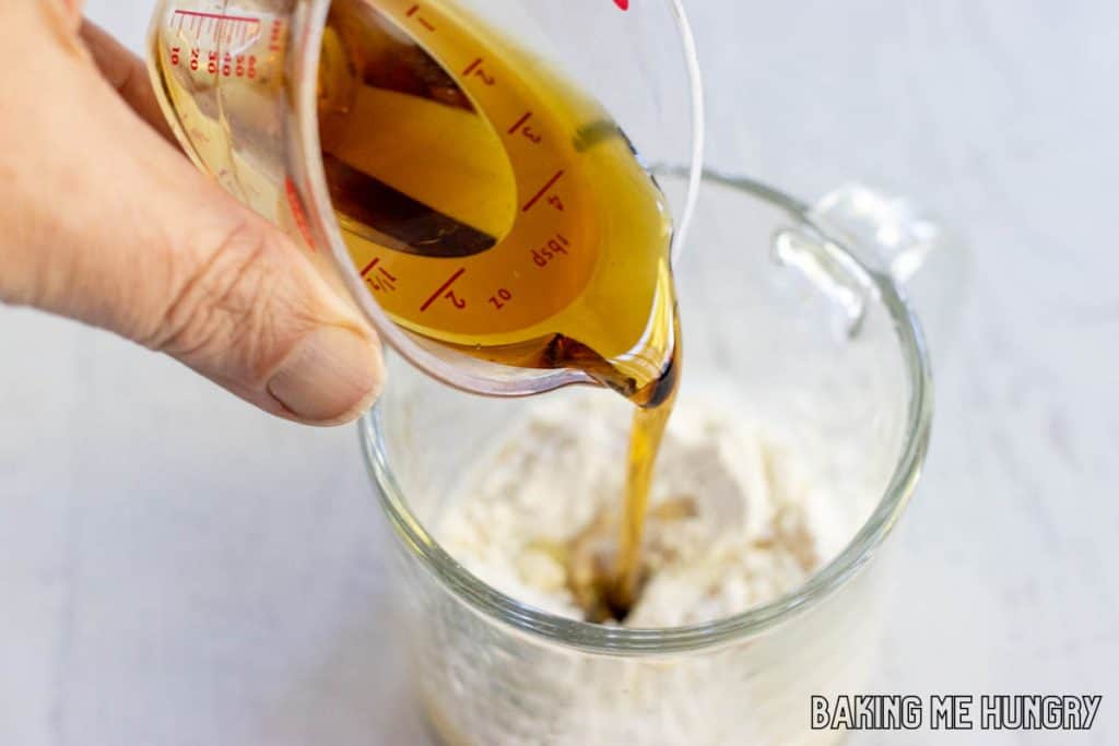 hand pouring in the syrup